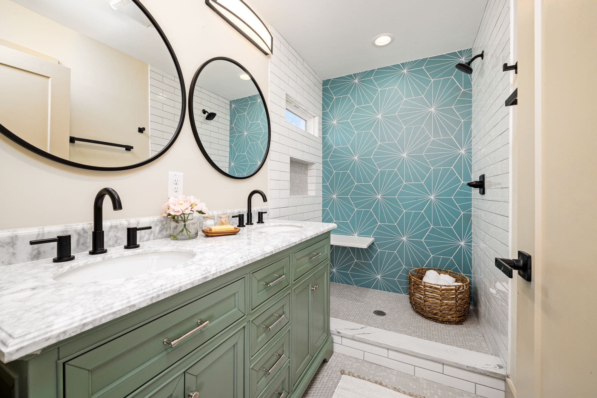 Modern bathroom with a double vanity and tiled shower, shown as representative remodeling imagery