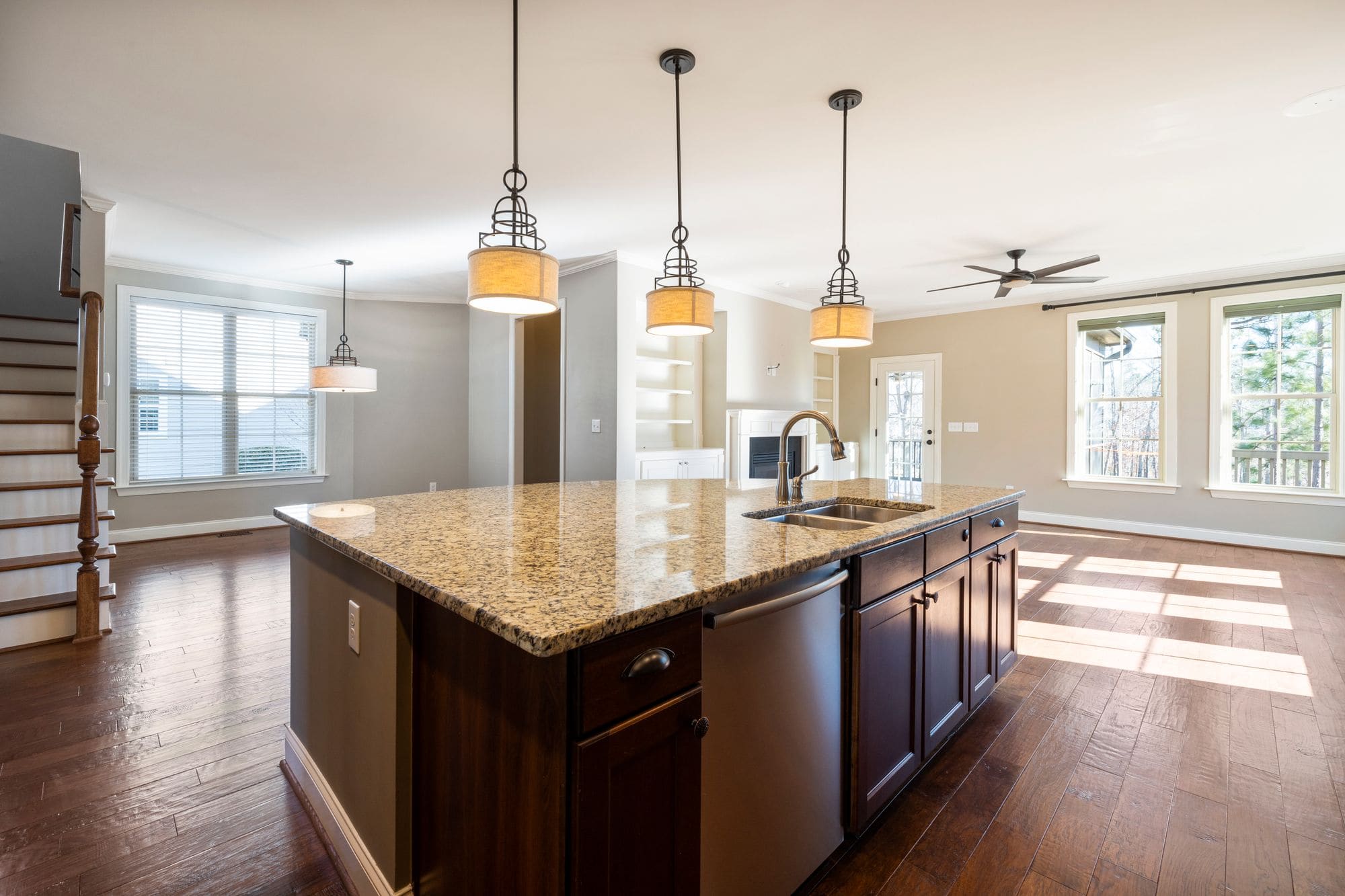 Open kitchen with a large island and natural light, shown as representative remodeling imagery